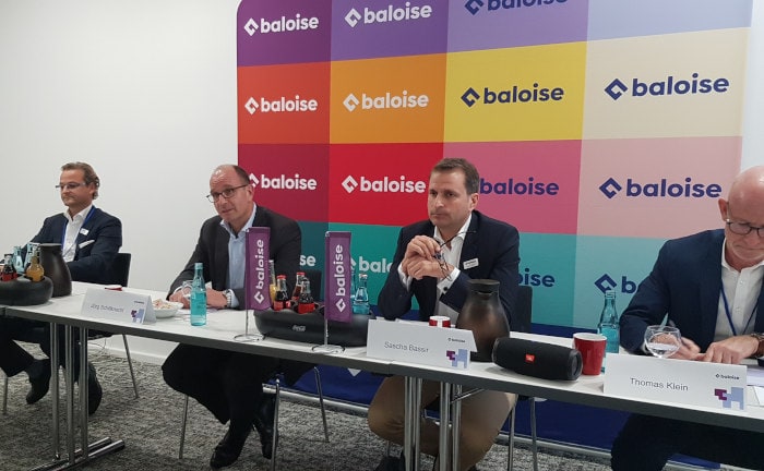 Baloise-Funktionäre vor den neuen Unternehmensfarben (v.l.): Bernd Einmold, Jürg Schiltknecht, Sascha Bassir, Thomas Klein