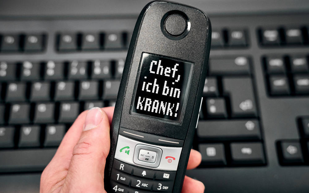 Krankmeldung am Telefon (Fotomontage)